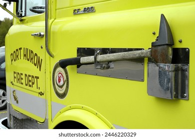 Unique parts and areas of a fire truck with an axe on the side of the fire truck used for breaking into doors and other objects. P0ort Huron, Michigan Created 03.25.24               Foto stock editoriale