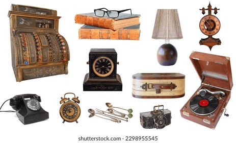 Vintage objects isolated on white background. Vintage and antique alarm clock, desktop clock, lamp, photo camera, suitcase, telephone, microphone, books, glasses, cash register and record player Stock Photo