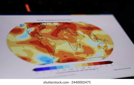 Viersen, Germany - March 9. 2024: Smartphone screen on computer keyboard with World  Meteorological Organization WMO state of global climate warming map (focus on center of screen) Foto Editorial Stock
