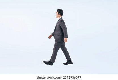 Walking Middle aged Asian businessman. Foto stock