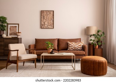 Warm and cozy interior of living room space with brown sofa, pouf, beige carpet, lamp, mock up poster frame, decoration, plant and coffee table. Cozy home decor. Template.  Stock-foto