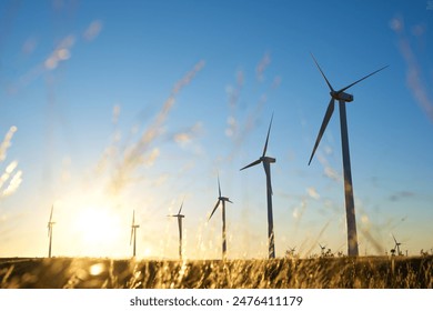 太陽光で電気エネルギーを作り続ける風力発電機の写真素材