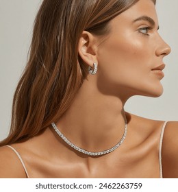 woman looking away wearing diamond tennis necklace and diamond hoops
