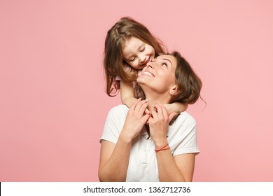 Woman mama in light clothes have fun with cute child baby girl. Mother little kid daughter isolated on pastel pink wall background studio portrait Mother's Day love family parenthood childhood concept Stock Photo