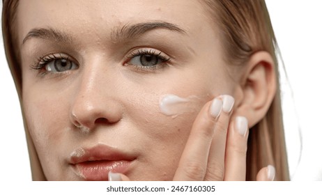 Woman's face, close-up, on a white background Arkistovalokuva
