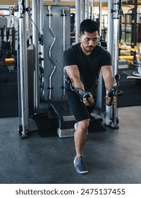 Young Asian Man Bodybuilder Doing Workout At Gym Stock Photo