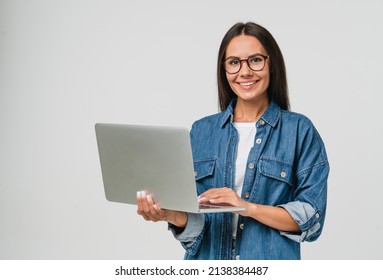 Young smiling caucasian student freelancer woman using laptop for remote work, e-learning at university college, e-banking, online shopping, webinars isolated in white background Adlı Stok Fotoğraf
