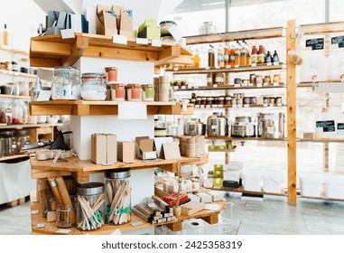 Стоковая фотография: Zero waste shop interior. Wooden shelves with varieties of cosmetic products. Eco-friendly shopping at local store. Small business of plastic free grocery store.