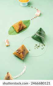 zongzi, rice dumplings,Made with glutinous rice and meat or egg yolk(Dates and Red Beans), wrapped in zong leaves, a common food for the Dragon Boat Festival in Asian countries. 库存照片