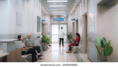 Active Local Indian Health Clinic Corridor, Representing Modern and Advanced Healthcare Services with Nurses and Doctors. Diverse Patients Waiting in Reception Hall in a Hospital Stockfoto