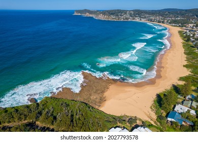 Aerial drone shots of waves crashing on to North Avoca Beach, New South Wales, Australia Foto Stok