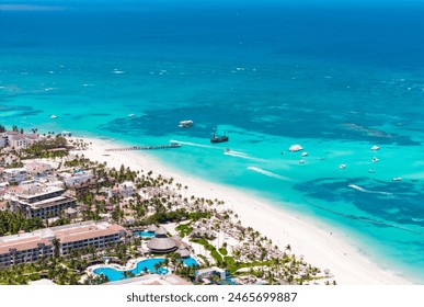 Aerial view of beautiful tropical white sand Los Corales beach in Punta Cana. Moored pirate ship in turquoise Caribbean sea water. Best attractions and excursions in Dominican Republic  Stock-foto