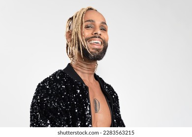 African-american homosexual male smiling isolated on white background. Bearded gay with beard and make up close up portrait 库存照片