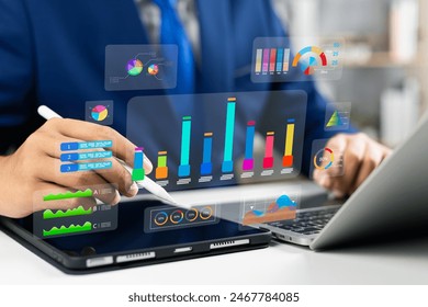 Analyst utilizing technology and dashboard with charts data science and Big Data technology for business, Strategic data management system with KPI organization performance with technology and metrics 库存照片