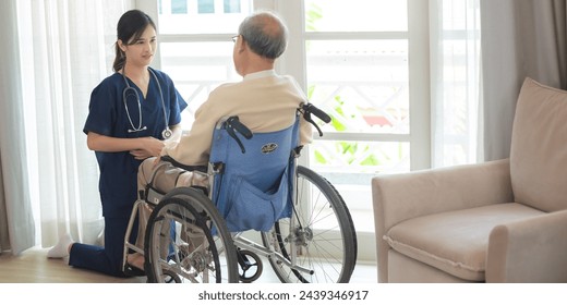 asian woman doctor nursing home to helping take care to retirement patient who sitting on wheelchair, caregiver nurse support to medical health care insurance at home or hospital, elderly senior man 库存照片