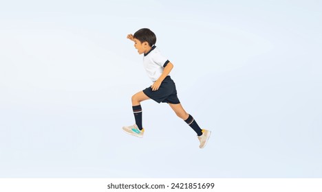 Asian elementary school boy jumping wearing gym clothes Stockfoto
