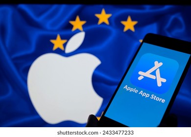 The Apple App Store icon displayed on a smartphone with Apple Inc logo visible in the background in this photo illustration. Taken in Brussels, Belgium. On March 4, 2024. – Ảnh báo chí có sẵn