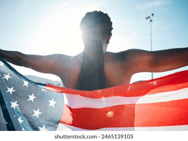 Athlete, American flag and sports with a woman outdoor at a stadium to celebrate country, pride and win. Back of a person for sport event , fitness and exercise achievement at competition in USA स्टॉक फ़ोटो