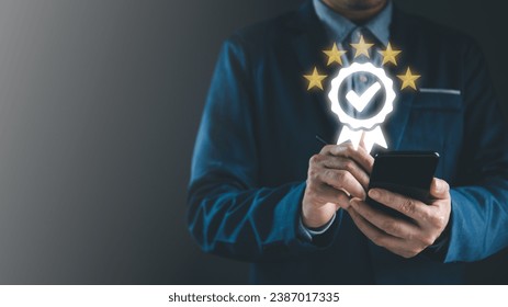 Auditor or businessman give the excellent score for ISO audit result on smart phone by digital pen, best standardize and quality for business to guarantee good service and control process system. Stockfoto