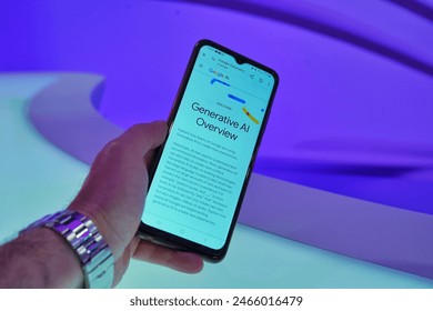 BOSNIA AND HERCEGOVINA, SARAJEVO, 22.5.2024: Photo of a mobile device in mans hand with generative google AI Overview on the screen., fotografie de stoc Editorial