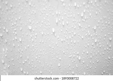 Blurred many water droplets on a white wall in a restroom area for background backdrop 库存照片