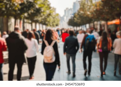 blurred for background. Crowd of people on the street. people walking on the city street. A blurry people walking. Urban, social concept. Abstract urban background with blurred buildings and street. Stockfoto