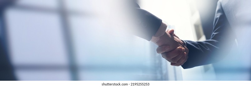 Businessmen making handshake with partner, greeting, dealing, merger and acquisition, business cooperation concept, joint venture, copy space for business, finance and investment background Stock-foto