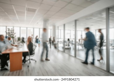 business people walking in the corridor of an business center, pronounced motion blur, crowded bright modern light office movement defocused. office background busy. talking and rushing in the lobby. ภาพถ่ายสต็อก