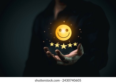 Business Quality Achievement and Excellence Concept. Businessman holding showcases a glowing five-star rating and award badge, symbolizing high quality and excellence in business. Stockfoto