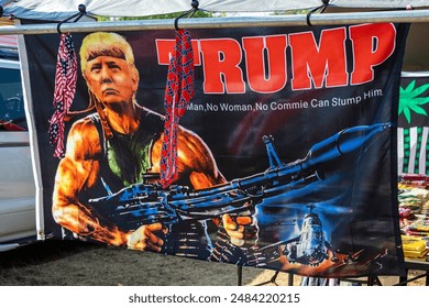 Chambersburg Pennsylvania USA 9-21-2019 Donald Trump as Rambo banner for sale at outdoor flea market Toimituksellinen arkistovalokuva