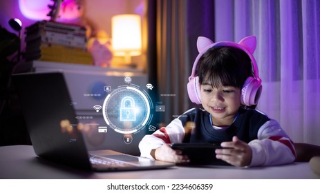 Child safety online. Little girl using smartphone at home. icon of internet blocking app on foreground – Ảnh có sẵn