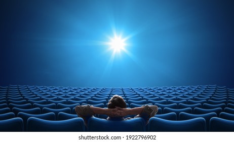 Cinema with person sitting in center 16:9 format Foto stock
