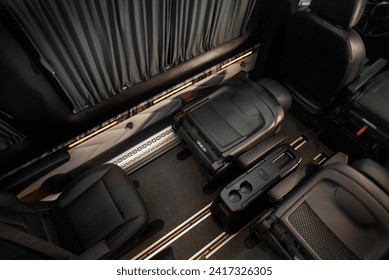 comfortable passenger bus interior with upholstered seats; individual transfer for a group of people; conversion of the interior of a truck; ภาพถ่ายสต็อก