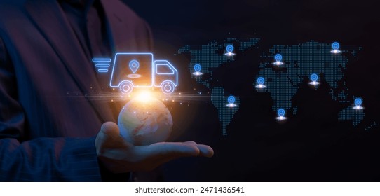 Concept of transportation, distribution, global logistics network, import-export, delivery and shipping. Businessman holding earth global with truck car with GPS location pin pointer icon. 库存照片