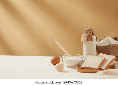 Copy space photo of baking homemade cake on light brown background with some essential ingredients for cooking, culinary concept, copy space, front view: stockfoto