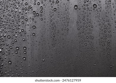 Close up of water droplets on dark cover background. Water droplets concept.: stockfoto