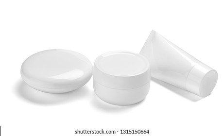 close up of  a white beauty cream container and tube on white background, fotografie de stoc