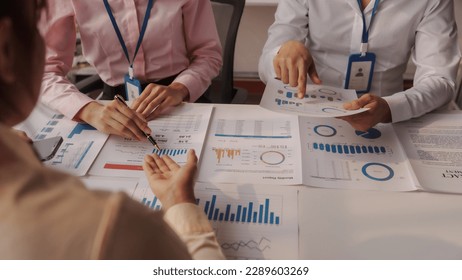 Close up brainstorming of asian businesswoman, bookkeeping, industrial sector of government partnership company, colleague working together to check audit, balance sheet to prevent fraud and bribery: stockfoto