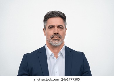 Closeup headshot face portrait of worried boss businessman isolated on white studio background. Latin hispanic middle age focused man, manager, ceo in formal business suit looking stressed at camera Foto stock
