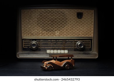 Classic Toy Cars from wood with old Radio Background.  Stock Photo