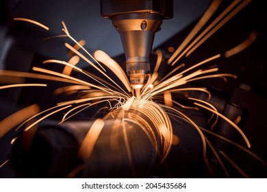 CNC Laser cutting of metal, modern industrial technology Making Industrial Details. The laser optics and CNC (computer numerical control) are used to direct the material or the laser beam generated. Stockfoto