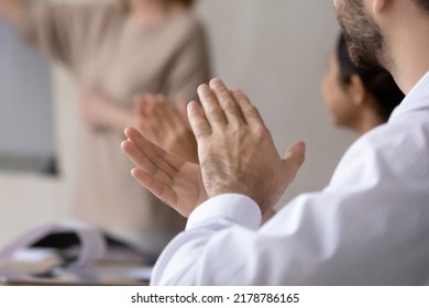 Crop close up of diverse employees applaud celebrating company business success at meeting. Excited workers clap hands greeting thanking coach or trainer for presentation. Acknowledgement concept. Arkistovalokuva