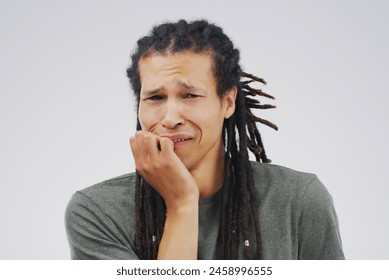 Crying, portrait and sad man in studio with depression, worry and broken heart on grey background. Pain, sorrow or emotional biracial guy frustrated by stress, anxiety and grief with loss or bad news Foto stock