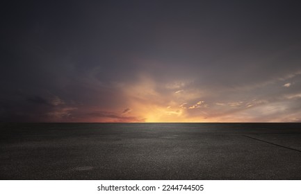美しい夕焼け雲の夜空の地平線と暗い床の背景の写真素材