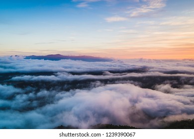 Dawn above the sea of clouds. Stock Photo