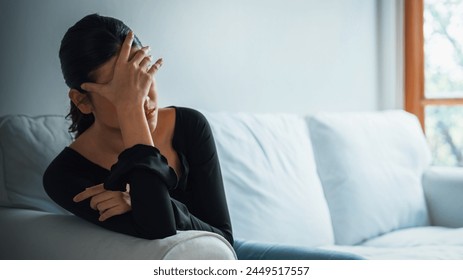 Depressed young Asian woman with mental health problem in mind need uttermost treatment from overthinking fatigue, disruptive thought, dissocial, anxiety and other mental health disorders .: zdjęcie stockowe