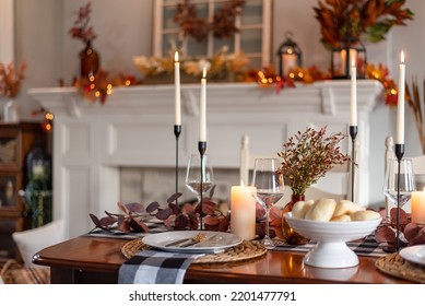 Dinner table decorated for cozy fall holiday gathering Stock Photo