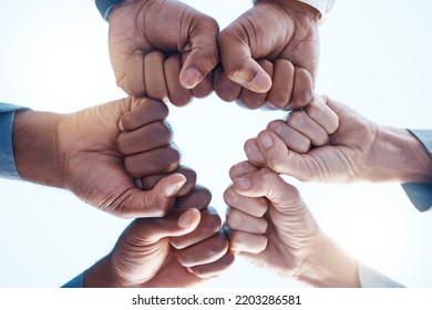 Diversity, fist bump and success of a corporate team collaboration winning a company business deal. Group, celebration and hands in unity at a business meeting for motivation and achievement. Foto stock