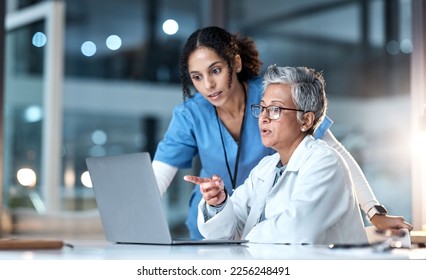 Стоковая фотография: Doctors, nurse or laptop in night healthcare, planning research or surgery teamwork in wellness hospital. Talking, thinking or medical women on technology for collaboration help or life insurance app