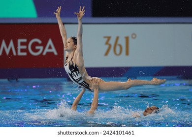 Doha, Qatar - February 9 2024: The Japanese team perform their silver-medal winning routine in the Artistic Swimming Team Free event at the Aspire Dome in the World Aquatics Championships Doha 2024. एडिटोरियल स्टॉक फ़ोटो